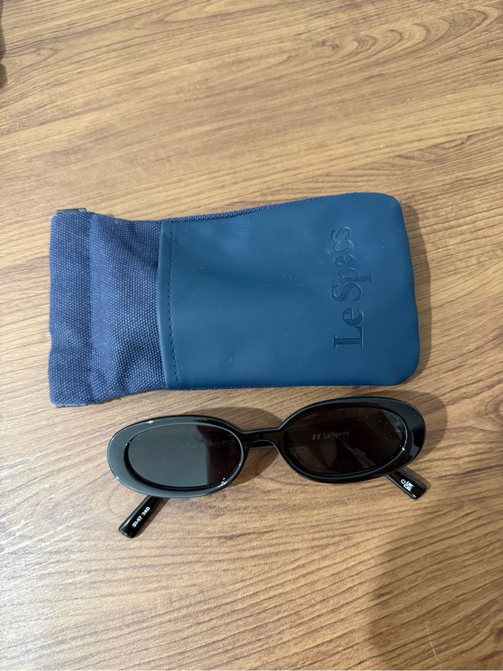 Le Specs Black Oval Sunglasses with Navy Pouch